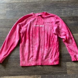 pink tie dye sweatshirt with i love jesus graphic on front